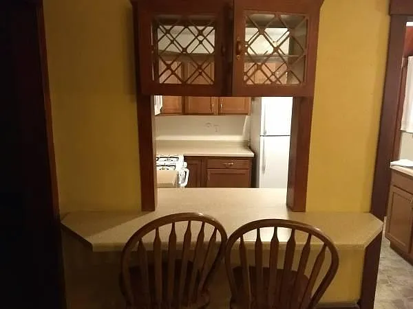 Breakfast counter from dining room into the kitchen