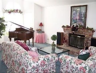 Family Room With Cozy Brick Fireplace