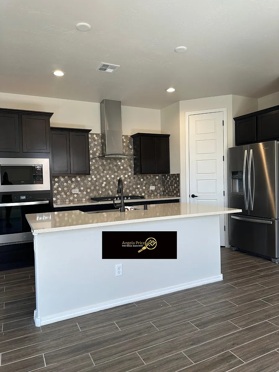 Gourmet Kitchen with Quartz counters, stainless steel appliances and gas range. - 7412 Redbloom Rd NW