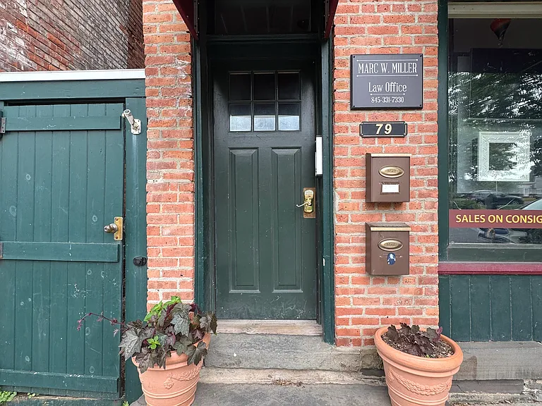 Front of building entrance with code access to third floor unit.