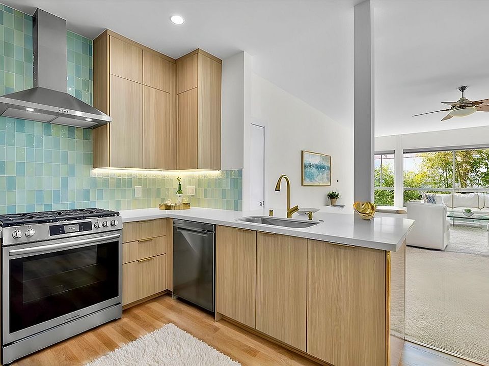 Your airy and bright open concept kitchen and huge living room (virtually staged.)