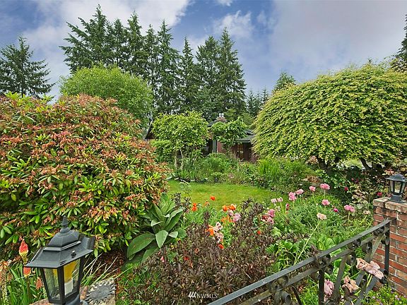 View from street with wrought iron fence.>