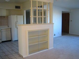 glass door cabinet between dining and kitchen