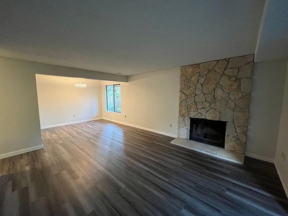 Living/dining room with wood burning fireplace