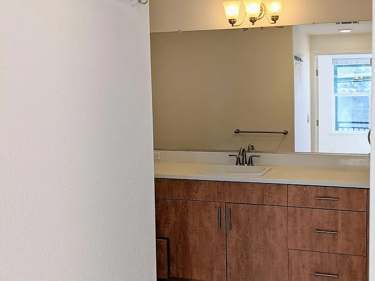 Master bedroom en suite bathroom complete with shower enclosure, vanity and storage, water-saving toilet and a full linen closet.