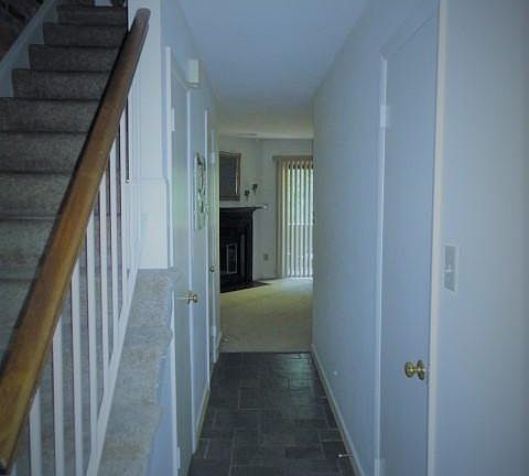 First floor with living and dining area, kitchin, storage in hallway and half bath.