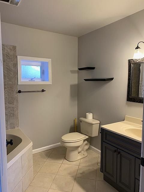 Second master bathroom with large soaking jet tub and shower combination