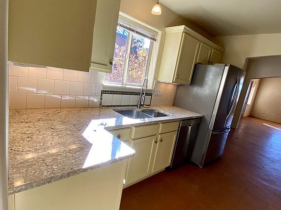 The sink, dishwasher, and refrigerator