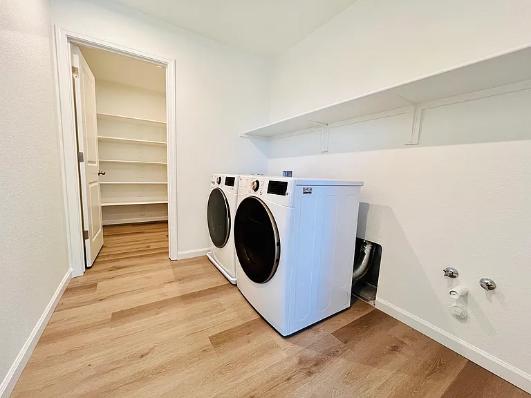 Laundry room with brand new washer-dryer