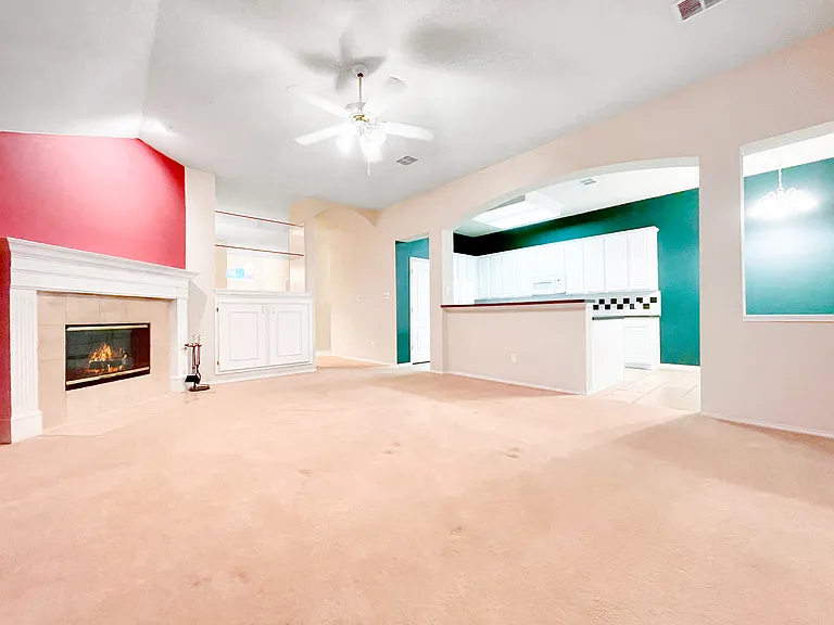 Living Room with Fireplace and Open Concept Kitchen