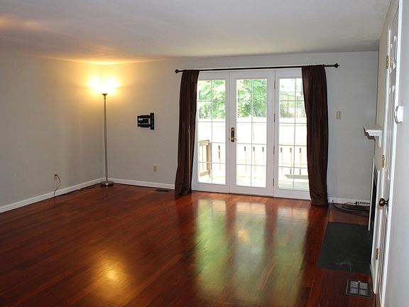Living / dining area with french doors to deck
