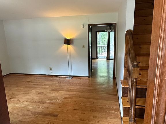 Front entrance opens up to the living room with hardwood floors.