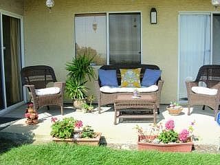 Private patio with large grass area facing the ocean