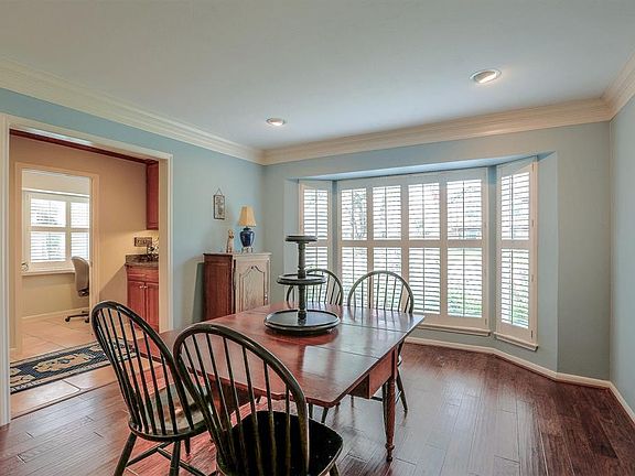 Another shot of the dining room with a view to the butler's pantry/dry bar and office space.