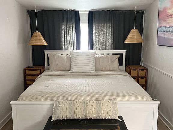king size bed and could be turned 90 degrees and fit on either wall, left or right as well. Many options for furniture set up
