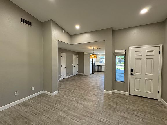 Living room area with front door entry