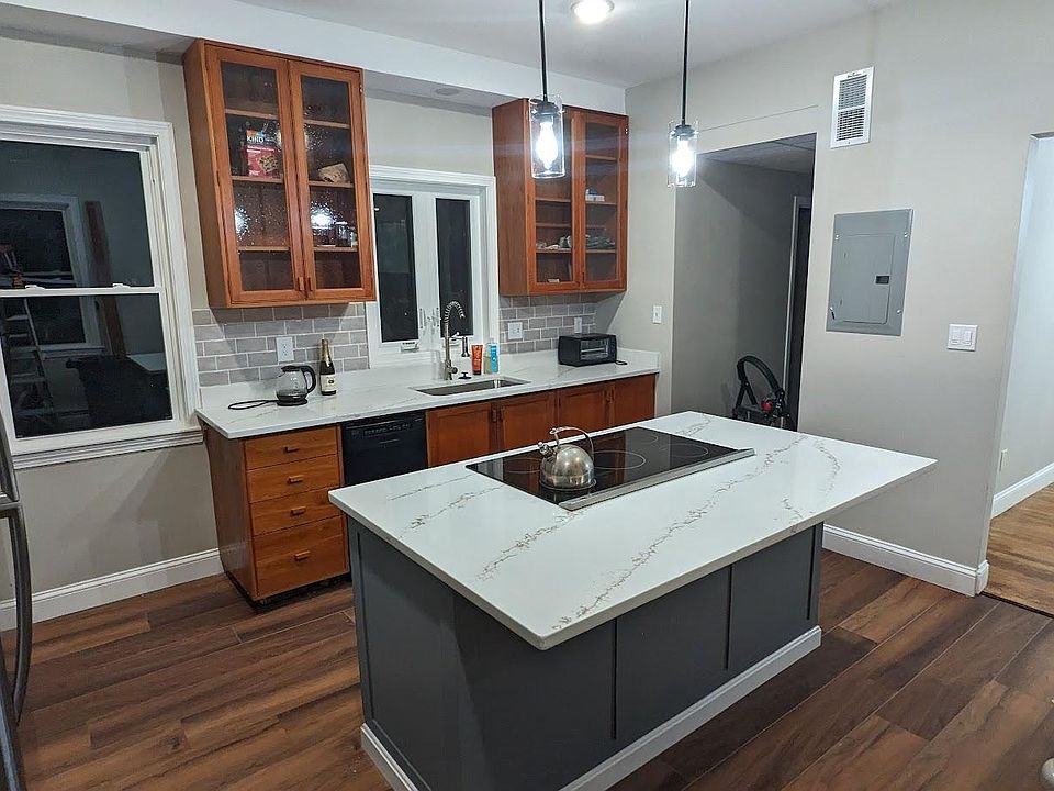 Kitchen with a new induction stove in the center island.