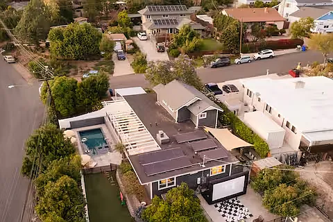 Charming two-story home with a modern facade and well-maintained landscaping. Features a private fenced backyard with pool, hot tub, and outdoor entertainment areas, creating a stylish and inviting retreat with plenty of outdoor space.