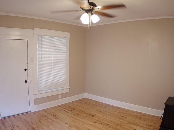 Front room showing interior door and gas fireplace