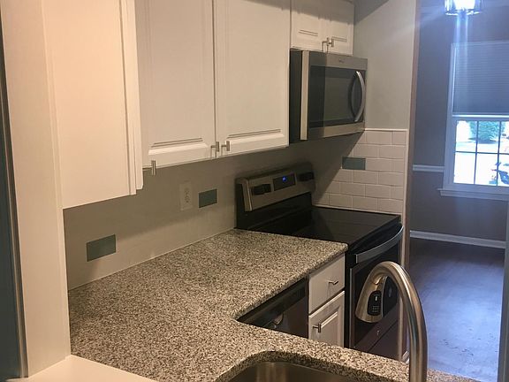 Fully updated kitchen complete with new cabinetry, granite counters, and new stainless appliances.
