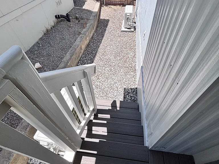 This bright, well-maintained mobilehome offers a crafted staricase that adds both style and saftey.