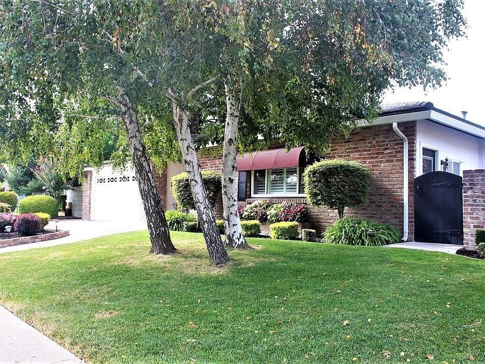 Incredible landscaping surrounds this beautiful home in Lincoln Village.