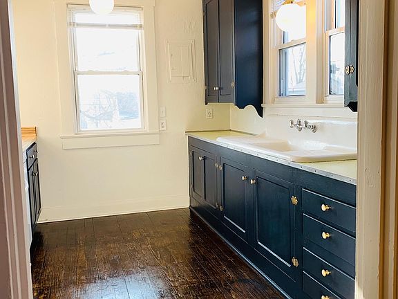 View into the well lit kitchen.