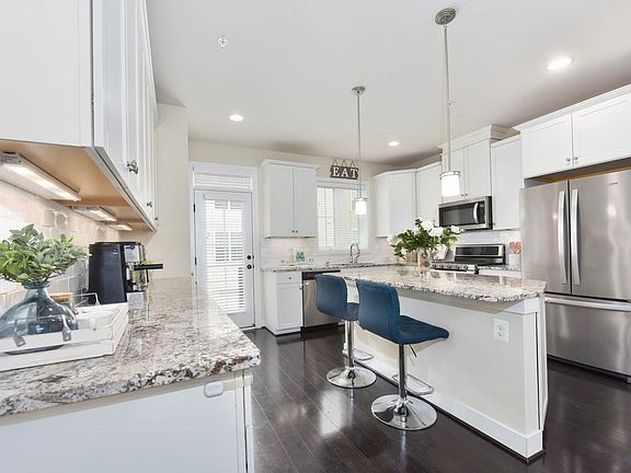 Convenient layout with breakfast bar _ great for quick meals and hosting