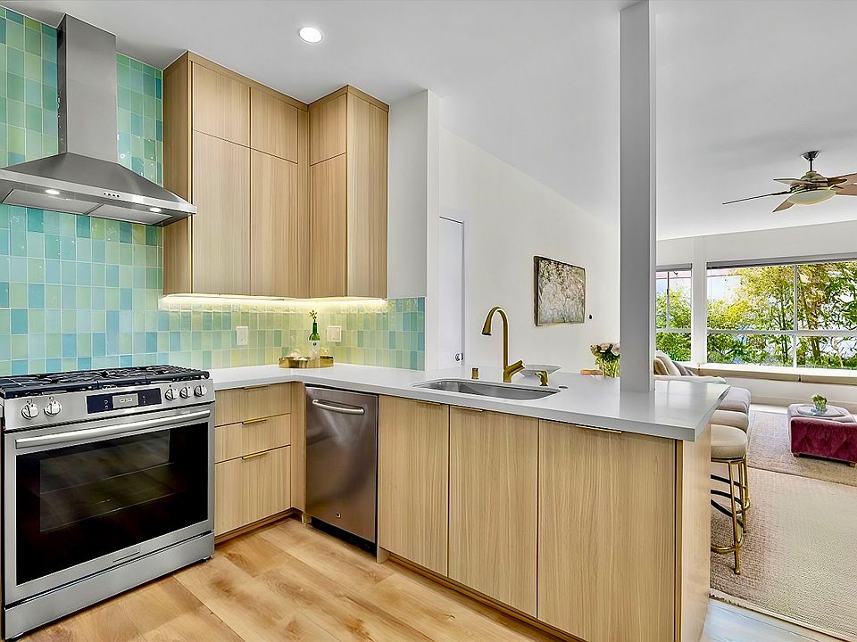 Beautiful zen coastal vibes are the theme of this space. (Virtually staged living room.)