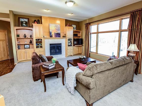 Main level living room with gas fireplace and built ins!
