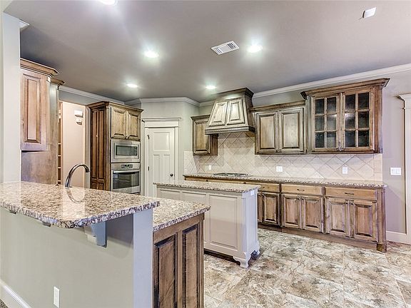 Another view of your new kitchen with a breakfast bar for extra eating space!