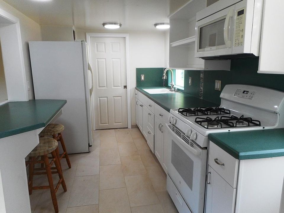 Functional remodeled kitchen. Newer appliances. Dine in counter.