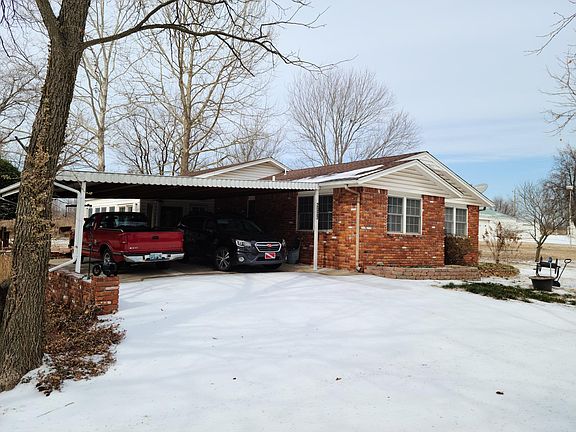 East side of house and carport.