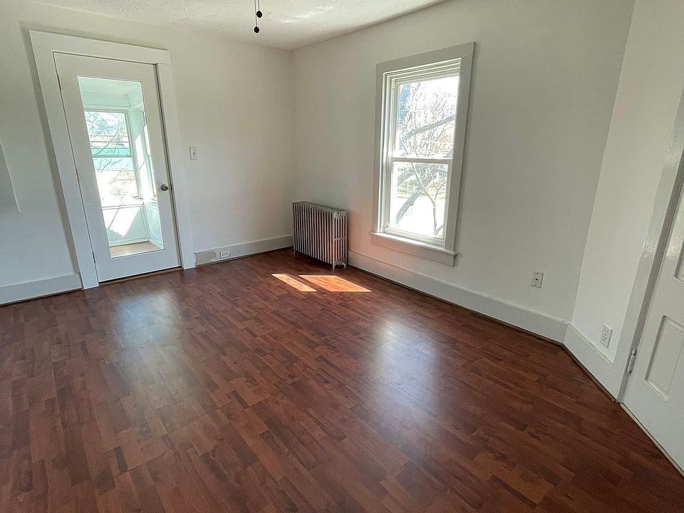 Living room with entrance to front, 3 season porch.