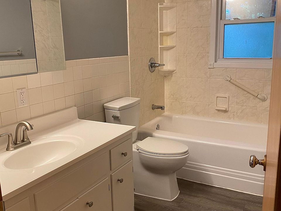 large bathroom with linen closet.
