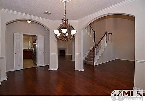 Formal dining with wood floors