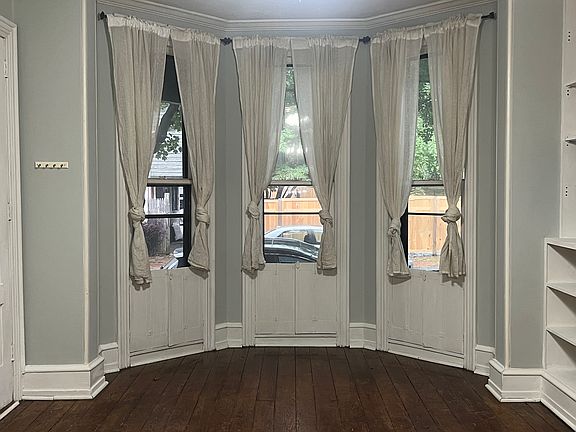 Living room with hardwood floors and plenty of natural light