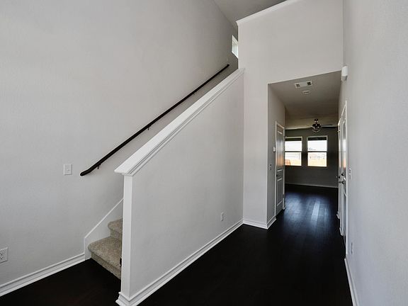 Entry with wood floors throughout the downstairs
