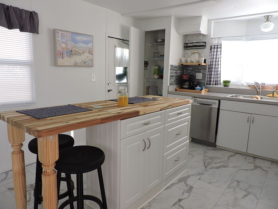 Kitchen with the main entrance in the background.