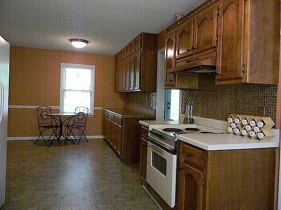 Additional view of the kitchen with new paint & glass tile back splash