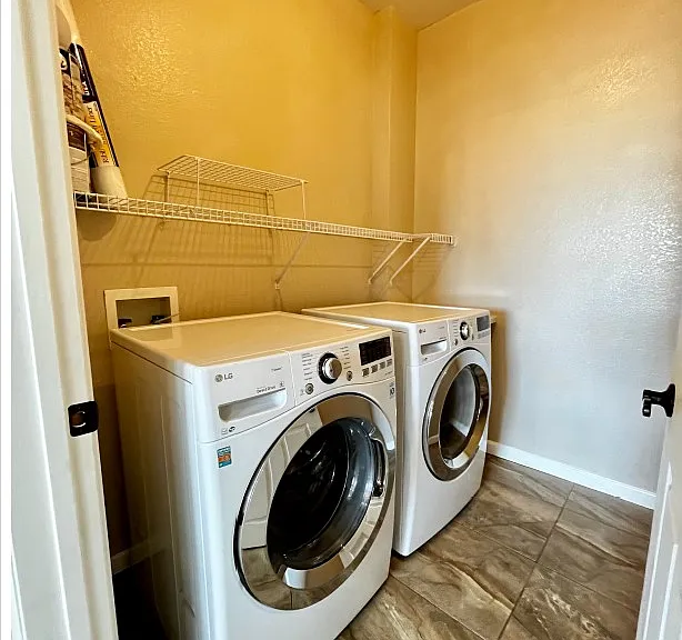 Separate laundry room in the hall leading to first bedroom.