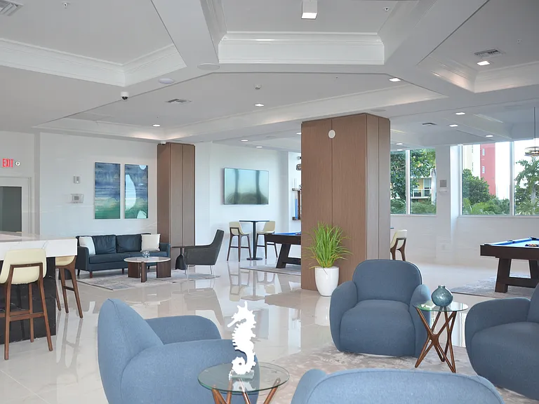 Welcome to our spacious clubhouse complete with comfortable seating, 2 bars, billiard tables, and large windows with amazing views