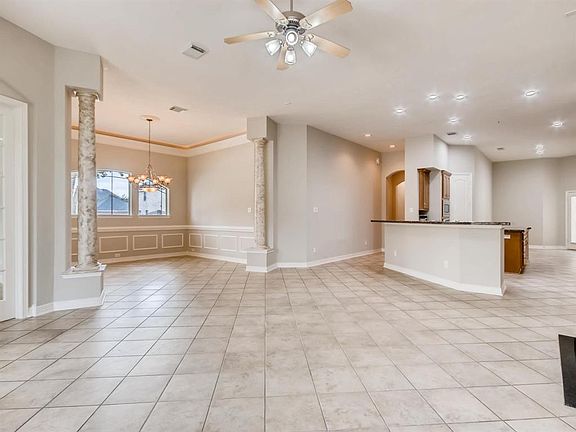 VIEW FROM FAMILY ROOM TO DINING ROOM & KITCHEN