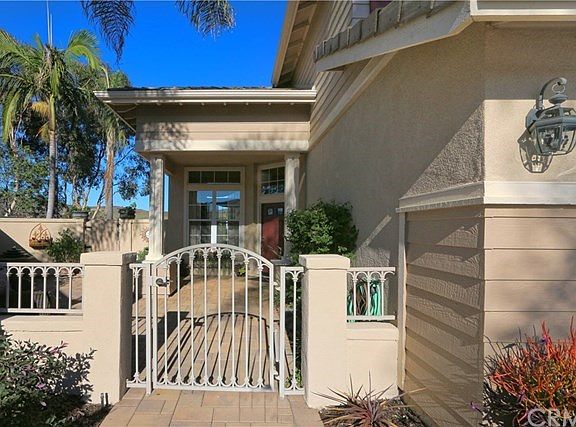 Front gate. Large front patio area. Separate gate then leads to back yard with pool and spa.