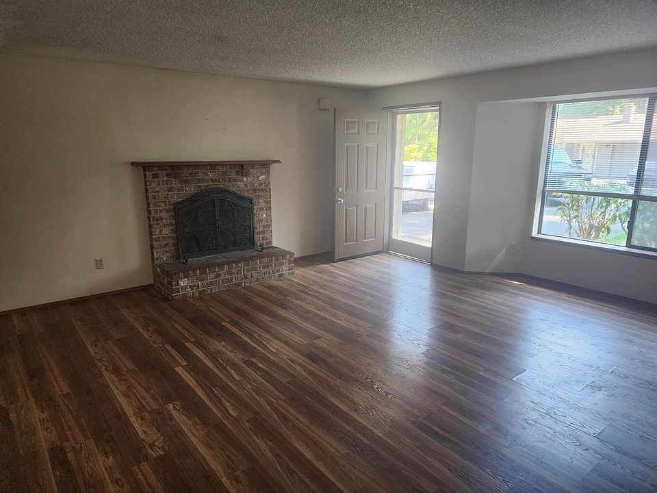 Huge living room with all hardwood flooring. A REAL FIREPLACE THAT WORKS. Nice large space leads to the family kitchen area and office space.