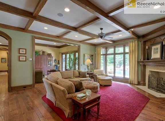 Hearth room/Family room over looks the exquisite backyard oasis.