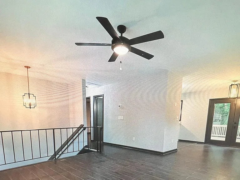 Living room/den next to kitchen and deck entrance