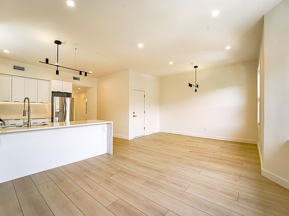 Dining room with modern light fixture