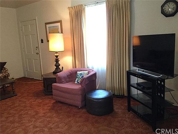 Step into the spacious, oversized living room of the front house.  The front house, approx. 1,241 sq feet (per assessor) consists of 3 bedrooms, 1.75 baths and a separate den or office behind the kitchen.