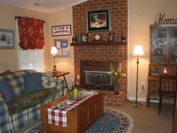 Living Room with Cathedral Ceiling, Brick Fireplace with Gas Logs